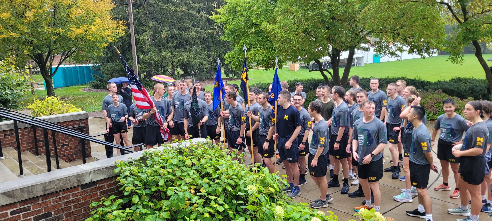 Group photo of cadet runners that just finished the race at landing ceremony waiting to move inside