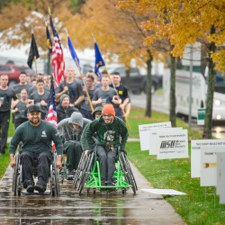 Rollers heading into the finish line with cadets running behind them