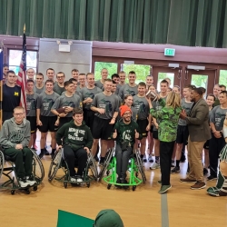 a large group photo of all runners and rollers along with Theresa Woodruff, Interim MSU President and Sparty