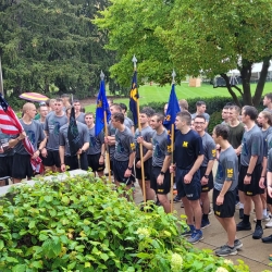 Group photo of cadet runners that just finished the race at landing ceremony waiting to move inside