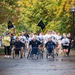 Last mile of race with runners and student athletes in wheelchairs