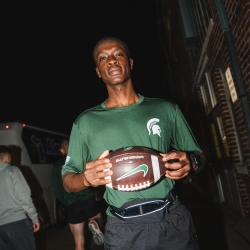 MSU Cadet holding a game ball